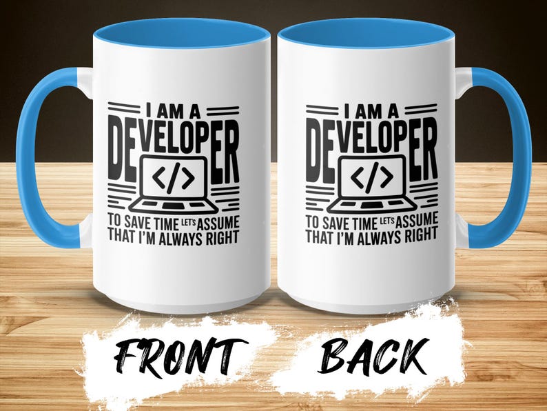 White mug with blue handle, features "I AM A DEVELOPER" text and code bracket graphic.