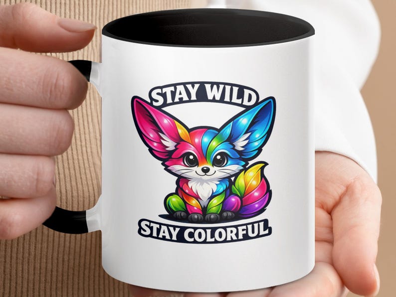Mug with rainbow fox illustration and text "STAY WILD STAY COLORFUL".