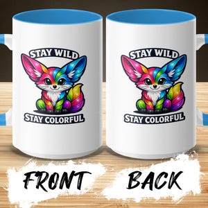 Two white mugs with blue handles, featuring a colorful fox and the text "STAY WILD STAY COLORFUL."