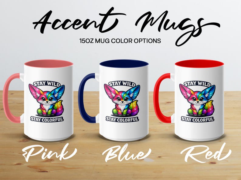 Three colorful fox mugs with "STAY WILD STAY COLORFUL" text, in pink, blue, and red.