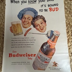 May include: Vintage Budweiser beer advertisement featuring illustrations of people, a bottle, and a glass of beer. The ad includes the text "When you know your beer, it's bound to be Bud." The bottle is brown with a red and white label.