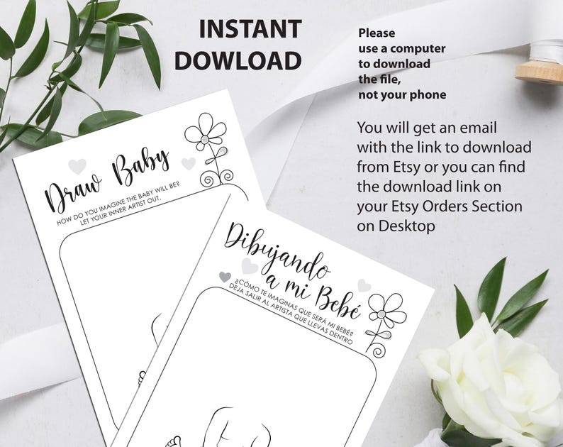 May include: Two printable baby shower game cards with instructions to draw a baby. The first card is in English and the second card is in Spanish. The cards feature a simple flower design.