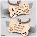 May include: Rose gold bone-shaped dog tag with a mountain and moon design on the front and the text "ROCKY" and the text "CALL MY MOM 123-456-7878 Thank you!" on the back.