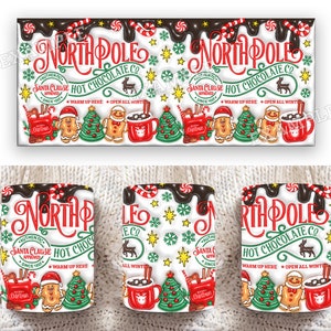 K&ouml;nnte beinhalten: Wei&szlig;e Keramiktasse mit einem rot-gr&uuml;n-wei&szlig;en Design mit dem Text "North Pole Hot Chocolate Co." und einem Cartoon-Lebkuchenmann. Die Tasse hat einen wei&szlig;en Henkel und ist mit Schneeflocken, Zuckerstangen und Sternen verziert.