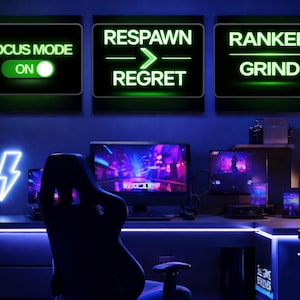 May include: A gaming setup with a neon lightning bolt and three illuminated signs that read "Focus Mode On", "Respawn -> Regret", and "Ranked Grind". The desk has multiple monitors, a gaming chair, and a glowing blue light.