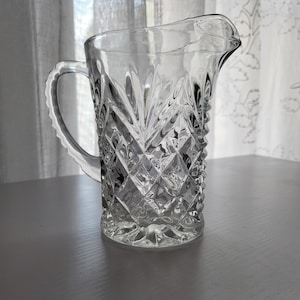 Small cut glass pitcher