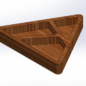 May include: A wooden triangular tray with three compartments. The tray is made of a light brown wood with visible grain. The edges are rounded, and the compartments are triangular.