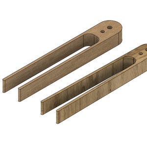 Puede incluir: Dos abrazaderas de madera con un recorte en el medio. Las abrazaderas son de madera marrón claro y tienen una veta de madera natural.