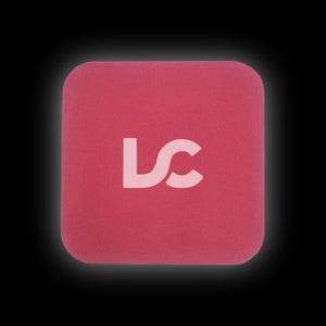 May include: A pink square-shaped foam block with the letters "LC" in white.