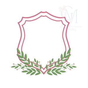 May include: A pink double-lined shield shape with a green leafy wreath around the bottom. The wreath has small white berries.