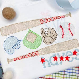 May include: Embroidered baseball themed design featuring a baseball bat, baseball, glove, helmet and home plate. The name "Hayes" is embroidered in blue with red stars.
