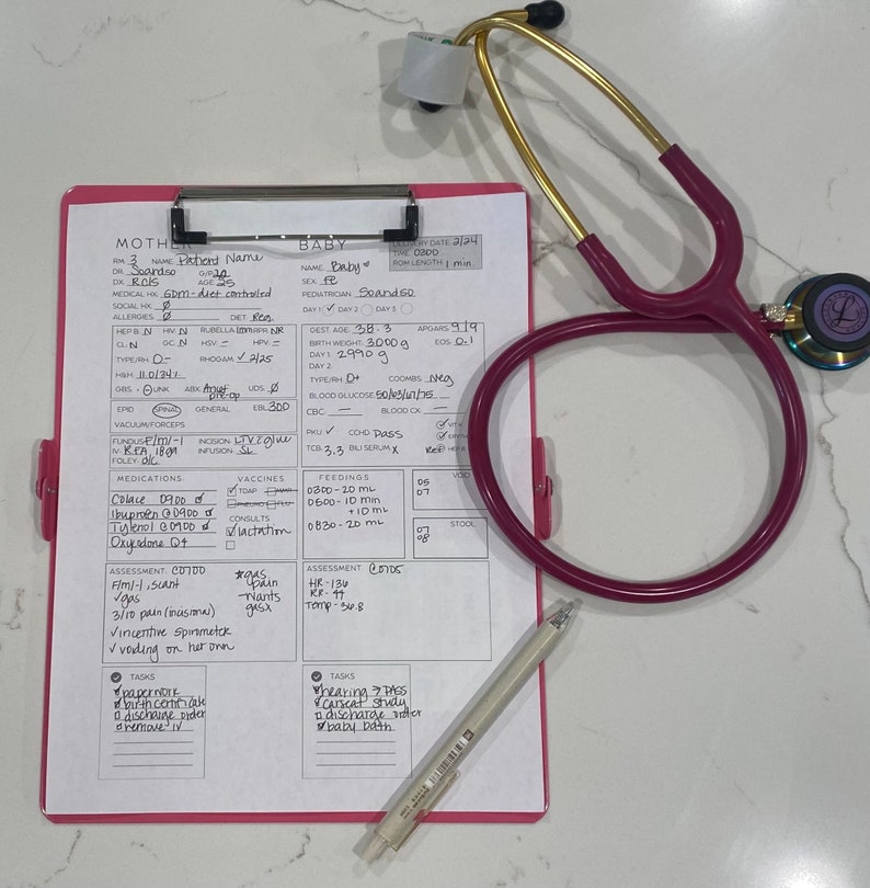 May include: A pink clipboard with a white sheet of paper. The paper has a baby's medical chart with headings like "Mother", "Baby", "Assessment", "Medications", "Feedings", "Vaccines", and "Tasks". The chart includes information about the baby's birth weight, gestational age, and other medical details. A stethoscope is lying on top of the clipboard.