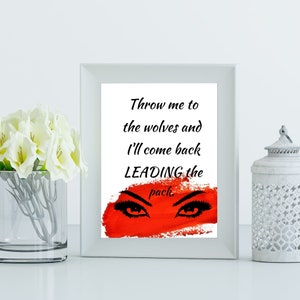 Może przedstawiać: Biały wydruk w ramie z czerwonym tłem i parą czarnych oczu z długimi rzęsami. Tekst na wydruku brzmi "Throw me to the wolves and I'll come back LEADING the pack."