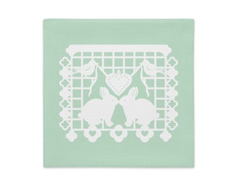 Bunny Rabbit decorative pillow sham 18"x18" in green with white papel picado from the book A Is For Alpaca And Amigos © by Lisa Osterman