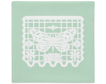 Butterfly decorative pillow sham 22"x22" in green with white papel picado from the book A Is For Alpaca And Amigos © by Lisa Osterman