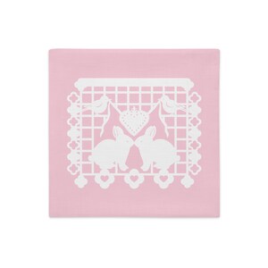 Bunny Rabbit decorative pillow sham 18&quot;x18&quot; in baby pink with white papel picado from the book A Is For Alpaca And Amigos © by Lisa Osterman
