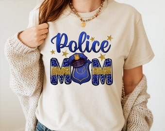 May include: A white t-shirt with the text "Police Mom" in blue and gold glitter. The text is surrounded by gold stars and a blue police badge with a gold star.