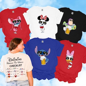 May include: A collection of colorful t-shirts featuring Disney characters with sunglasses and drinks. Designs include Stitch with beer, Minnie Mouse with wine, and Buzz Lightyear with a mug. The back of one shirt reads "Drinking Around the World Checklist."