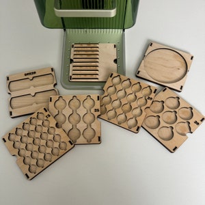 May include: Five wooden trays with different sized compartments for organising small items. The trays are labelled with numbers: 50x20, 15, 25, 20, and 30.