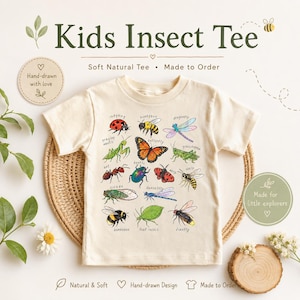 May include: A cream-coloured Kids Insect Tee featuring a colourful insect illustration. The shirt displays a ladybug, butterfly, dragonfly, and other insects. Text on the shirt reads "Kids Insect Tee", "Soft Natural Tee", and "Made to Order".