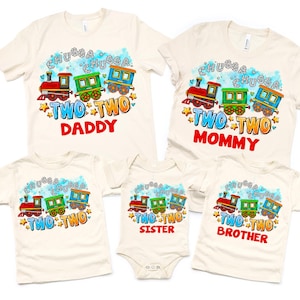 May include: Set of four cream colored t-shirts with a cartoon train design and the words "Chugga Chugga Two Two" on each shirt. The shirts are labeled "Daddy", "Mommy", "Sister", and "Brother".