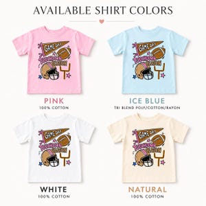 May include: Four short-sleeve t-shirts in pink, ice blue, white, and natural colors. Each shirt features a graphic with a brown football, a helmet, a goal post, a pennant reading GAME DAY, and the text TOUCHDOWN SEASON with small stars.