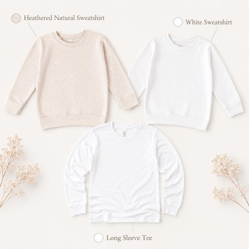 May include: Three plain tops are displayed on a white background. The top left is a heathered natural sweatshirt, the top right is a white sweatshirt, and the bottom is a white long sleeve tee. The garments are laid flat, ready for customisation.