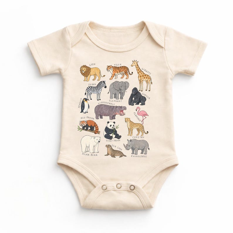 May include: A cream-colored baby onesie featuring a colorful illustration of various animals, including a lion, tiger, giraffe, zebra, elephant, gorilla, penguin, hippo, red panda, panda, cheetah, polar bear, sea lion, rhinoceros, and flamingo.