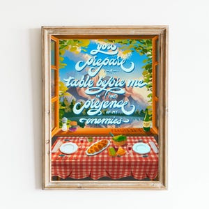 May include: A framed illustration of a window scene with a table set for a meal. The text reads "You prepare a table before me in the presence of my enemies".