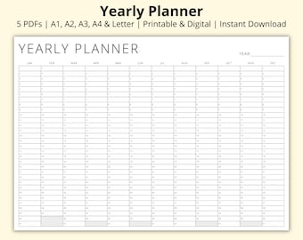 May include: A black and white yearly planner with a grid layout for each month of the year. The months are labeled January through December. The planner has a space at the top for the year.