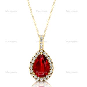 Pendentif poire et rubis en or jaune 14 carats : halo de diamants, pierre de naissance en juillet
