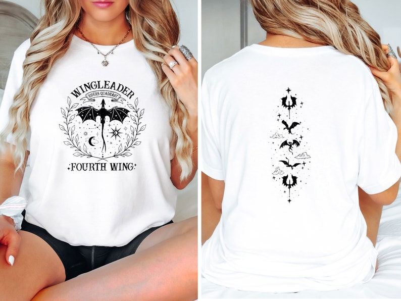 May include: White t-shirt with a black graphic design featuring a dragon and the text "WINGLEADER FOURTH WING". The back of the shirt has a vertical design of four dragons.