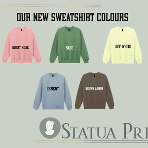 a collection of six different colored sweatshirts, each with a unique color and design, arranged in a grid layout.