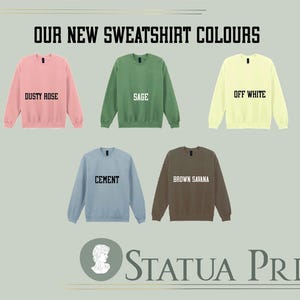 a collection of six different colored sweatshirts, each with a unique color and design, arranged in a grid layout.
