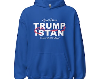 May include: A royal blue hooded sweatshirt with the text "God Bless Trumpistan" in white letters with a red outline. The text "Amen. Ya Na Mean?" is printed in smaller white letters below the main text.