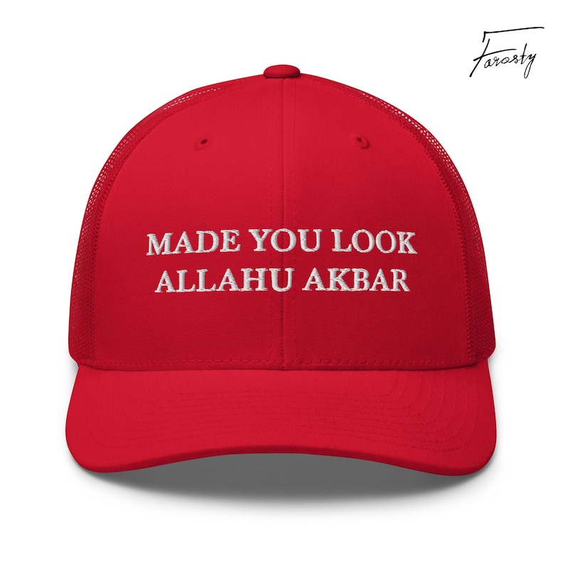 May include: Red mesh trucker hat with white embroidery that reads "Made You Look Allahu Akbar".