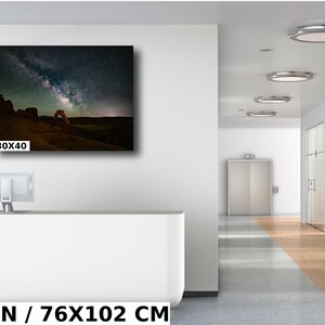 May include: A photograph of Delicate Arch in Arches National Park, Utah, with the Milky Way galaxy visible in the night sky. The image is printed on canvas and measures 30x40 inches.