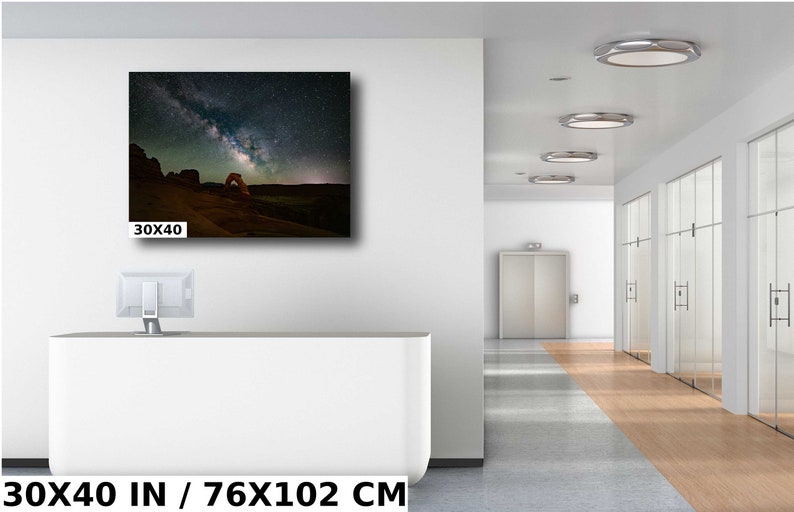 May include: A photograph of Delicate Arch in Arches National Park, Utah, with the Milky Way galaxy visible in the night sky. The image is printed on canvas and measures 30x40 inches.