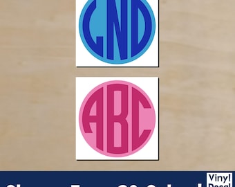 May include: Two monogram decals, one blue and one pink, each with three letters inside a circle. The blue decal has the letters "GND", and the pink decal has "ABC". The text "Choose From 30 Colors!" is at the bottom.