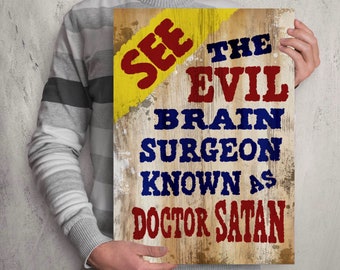 May include: A rustic wooden sign with yellow, red, and blue paint. The sign reads "See the Evil Brain Surgeon Known as Doctor Satan."