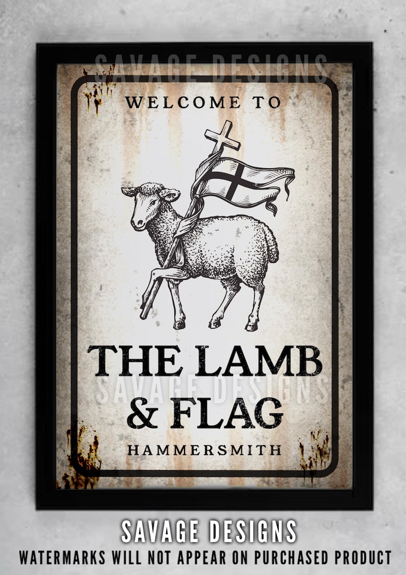 May include: A framed sign with a vintage aesthetic. The sign features a lamb holding a flag with a cross, and the text "WELCOME TO THE LAMB & FLAG HAMMERSMITH". The design includes the text "SAVAGE DESIGNS".
