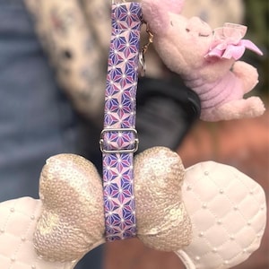 May include: A set of three ceramic mugs with a speckled, matte finish. The mugs are in shades of cream, light gray, and dark gray. Each mug has a simple, minimalist design and a rounded handle.