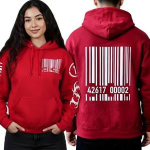 May include: Red hoodie with a barcode design on the front, back, and sleeve. The hoodie features a kangaroo pocket and a drawstring hood. The barcode design includes the numbers "42617 00002".