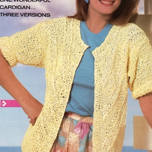 May include: A light yellow, open-front cardigan with short sleeves. The cardigan is made of a textured knit fabric. The image includes the text "ONE WONDERFUL CARDIGAN... THREE VERSIONS" and "classic greats: '86 style".