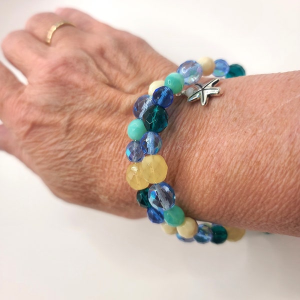 Memory wire multiple wrap bracelet, Czech glass beads in blues, greens, teal, cream, and topaz.  Bracelet accented with beaded dangles.