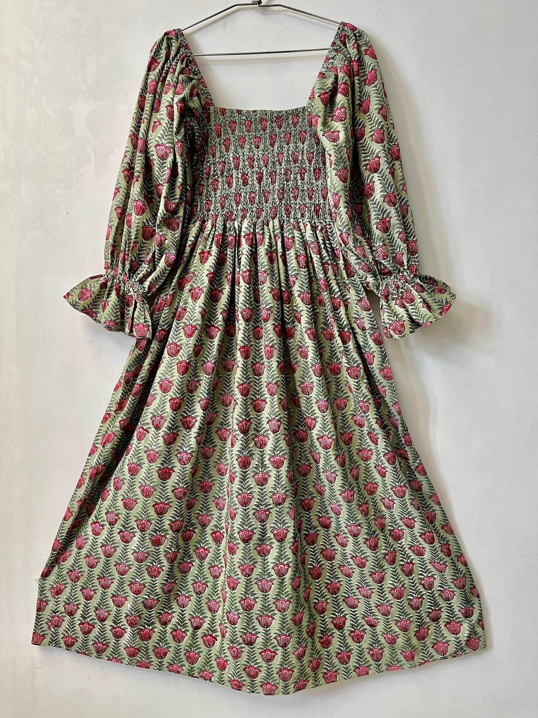 Off white hand block printed long dress with all-over Pink & Green coloured floral hand block print.