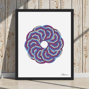May include: Framed art print featuring a circular design composed of concentric circles in shades of purple, blue, and tan. The artwork is set against a white background and framed in a black frame. The artist's signature is in the lower right corner.