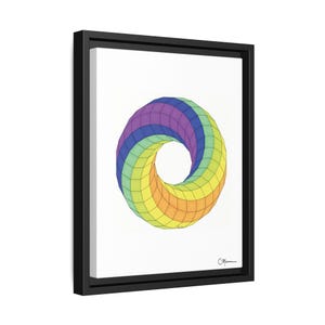 May include: A framed print of a colorful geometric design. The design is a rainbow-colored, 3D, geometric shape that resembles a donut. The shape is outlined in black.