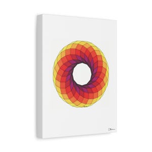 May include: A canvas print featuring a geometric design. The artwork showcases a vibrant, colorful pattern of concentric rings. The design transitions from yellow to orange, red, and purple, creating a visually striking piece. The canvas is mounted on a white frame.