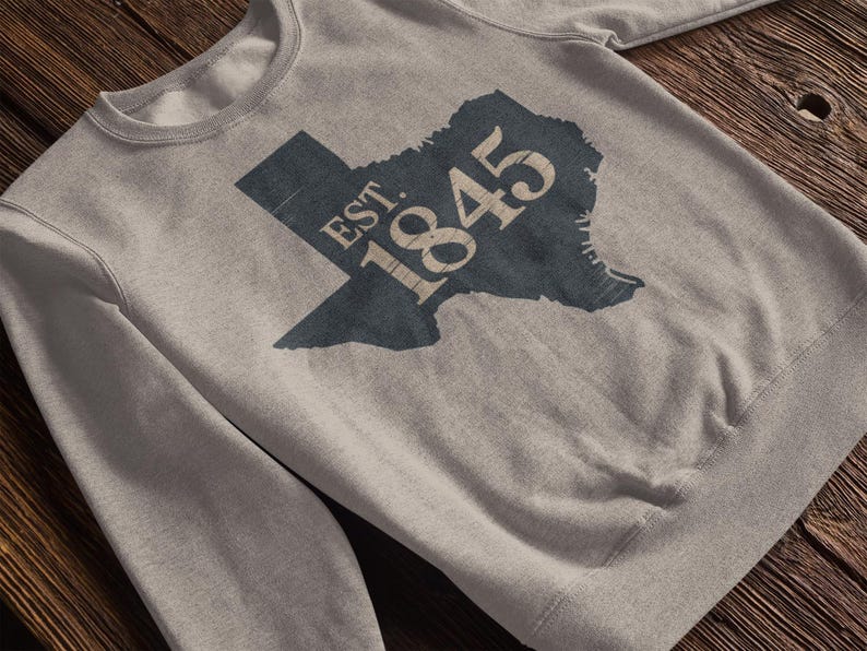 A grey sweatshirt with a texas silhouette that says "est. 1845"